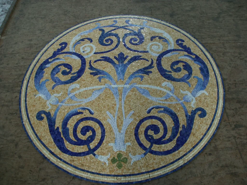 Cobalt Volute mosaic pool medallion, Cobalt and pale blue on cream, hand-cut stone — reference M-09, Mosaiclegs Art Studio