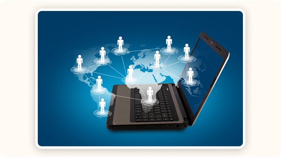 Laptop with global network connections and users linked across world map&nbsp;