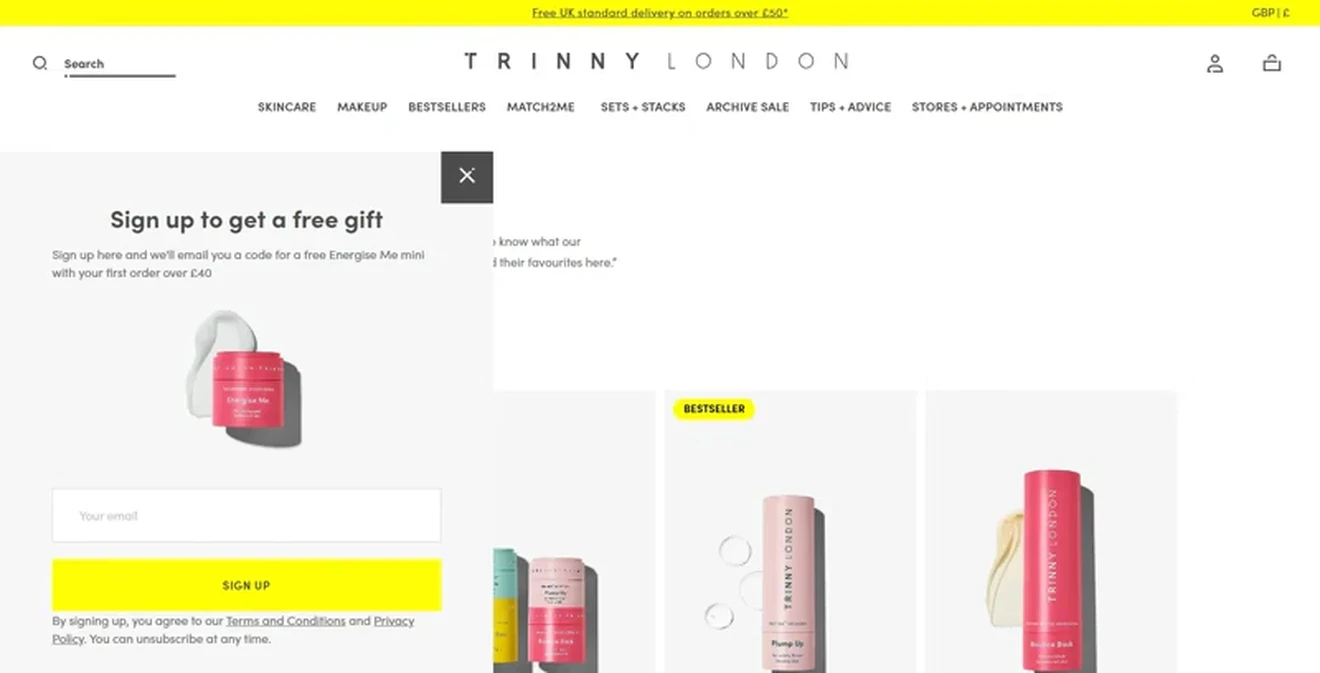 Trinny London slide-in email opt-in form offering a free Energise Me mini on first orders over £40.