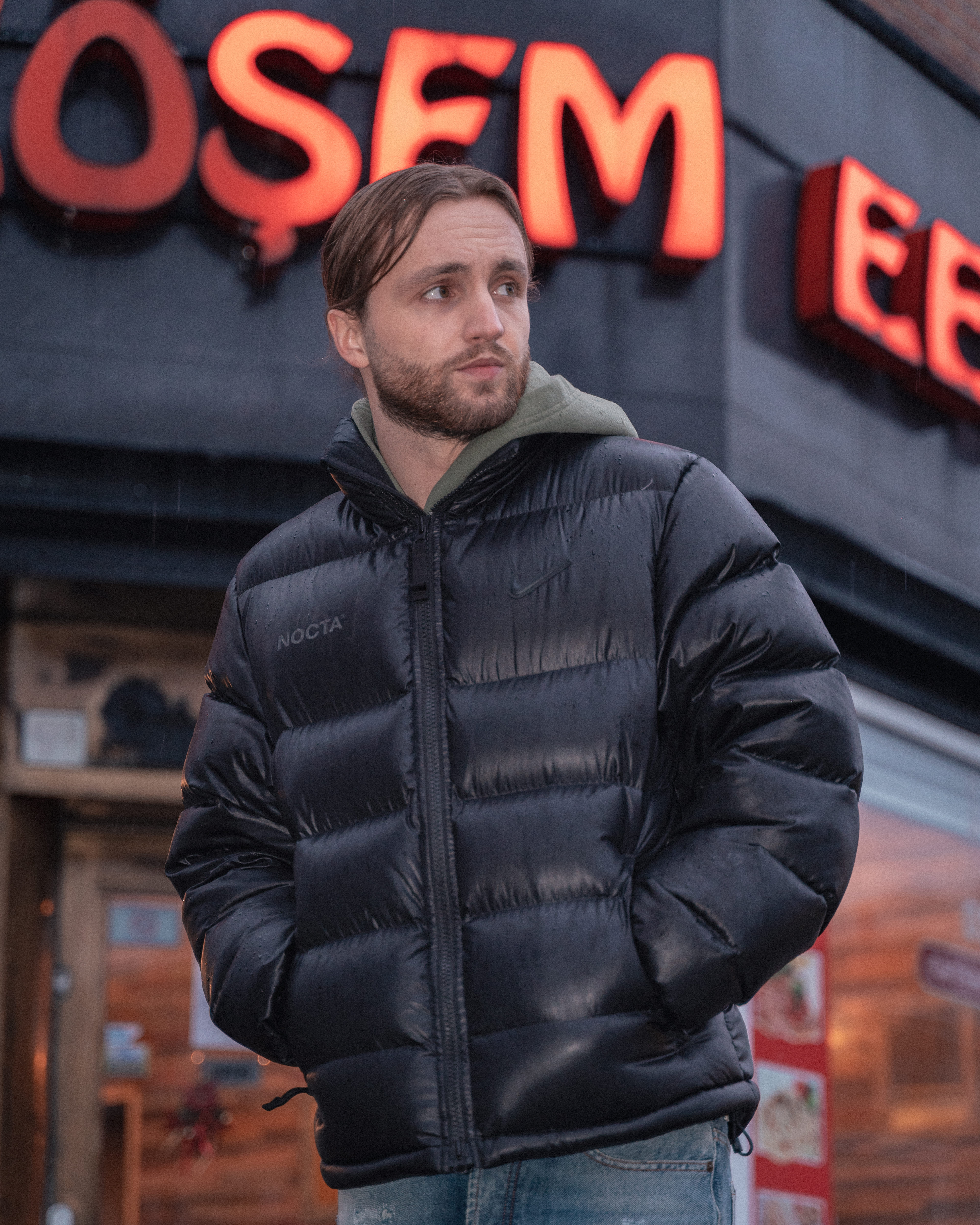 Streetside billboard with flyposters of the Batch.Works brand and illustrations