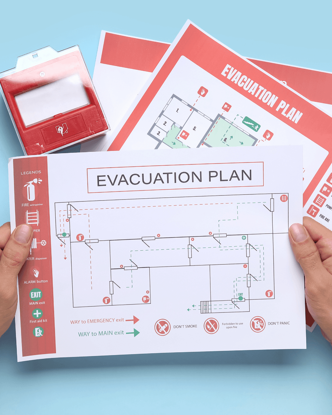 Evacuation plan documents showing fire escape routes and safety equipment symbols