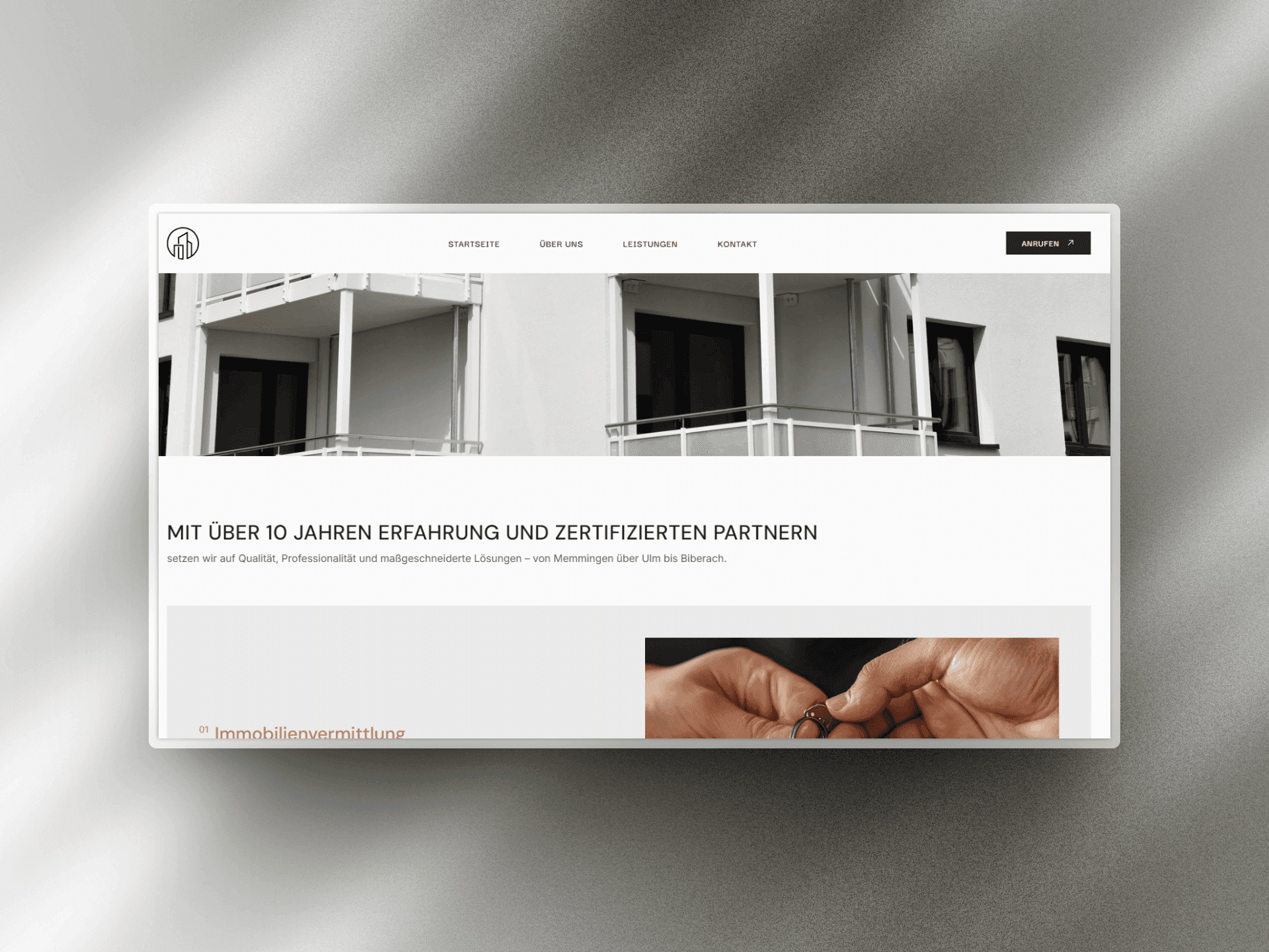 A minimalist webpage design featuring a modern interface with images and text elements.