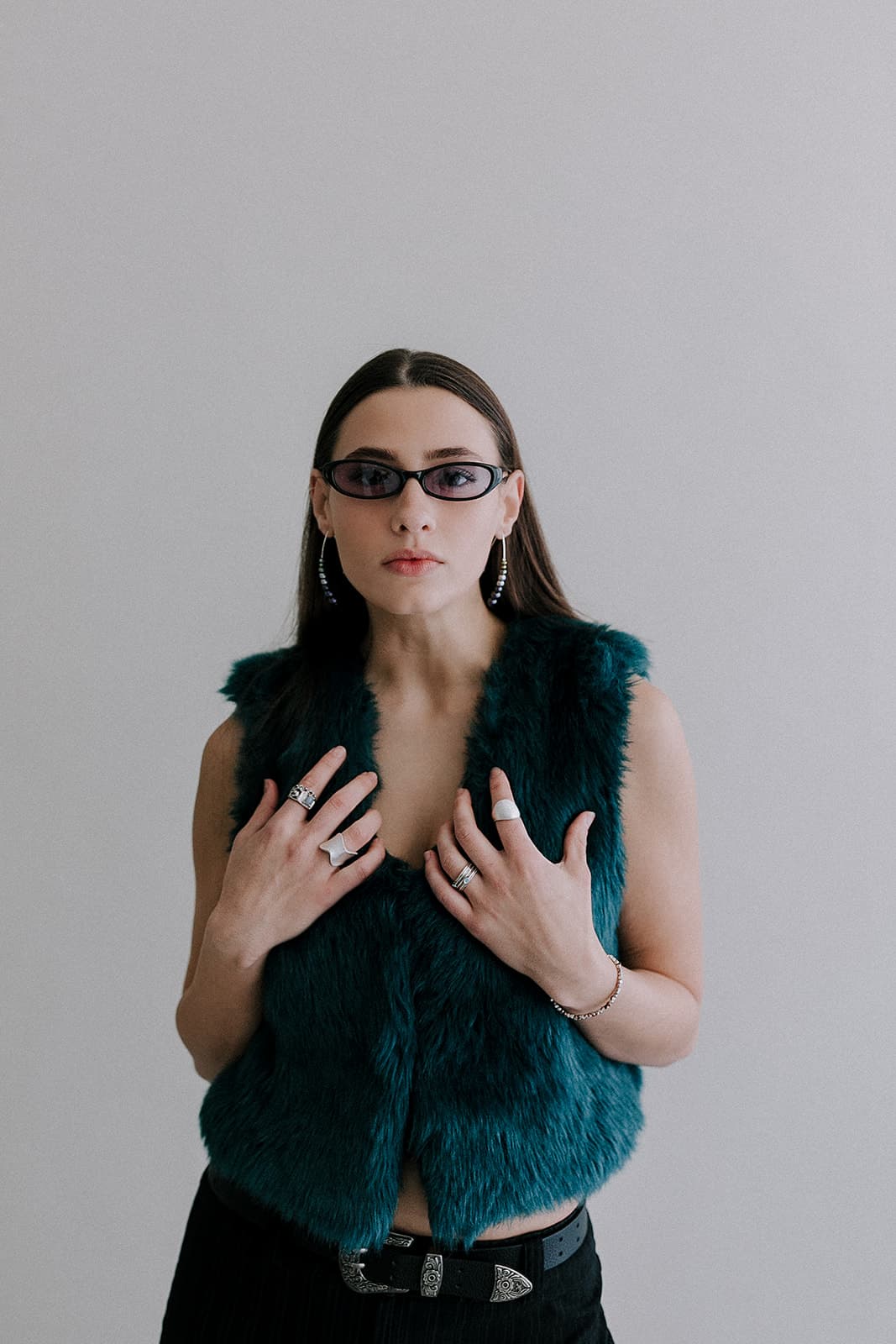 A dramatic portrait of the model gazing into the camera at Revelator Studio in Shreveport, captured by Justin Posey, emphasizing the studio’s clean and professional environment.