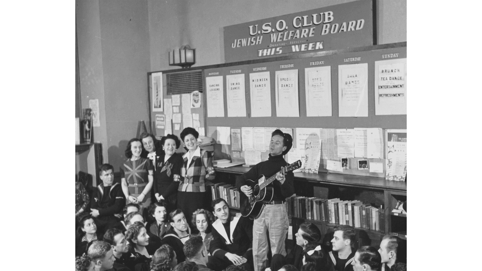 Woody Guthrie entertaining a Jewish group. Photo courtesy of Woody Guthrie Publications.