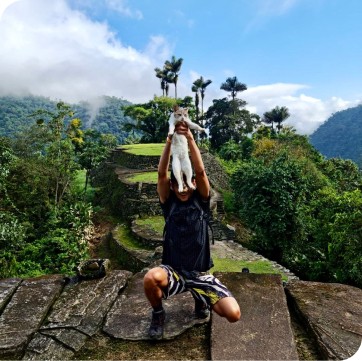 Fritz in Colombia holding a cat.