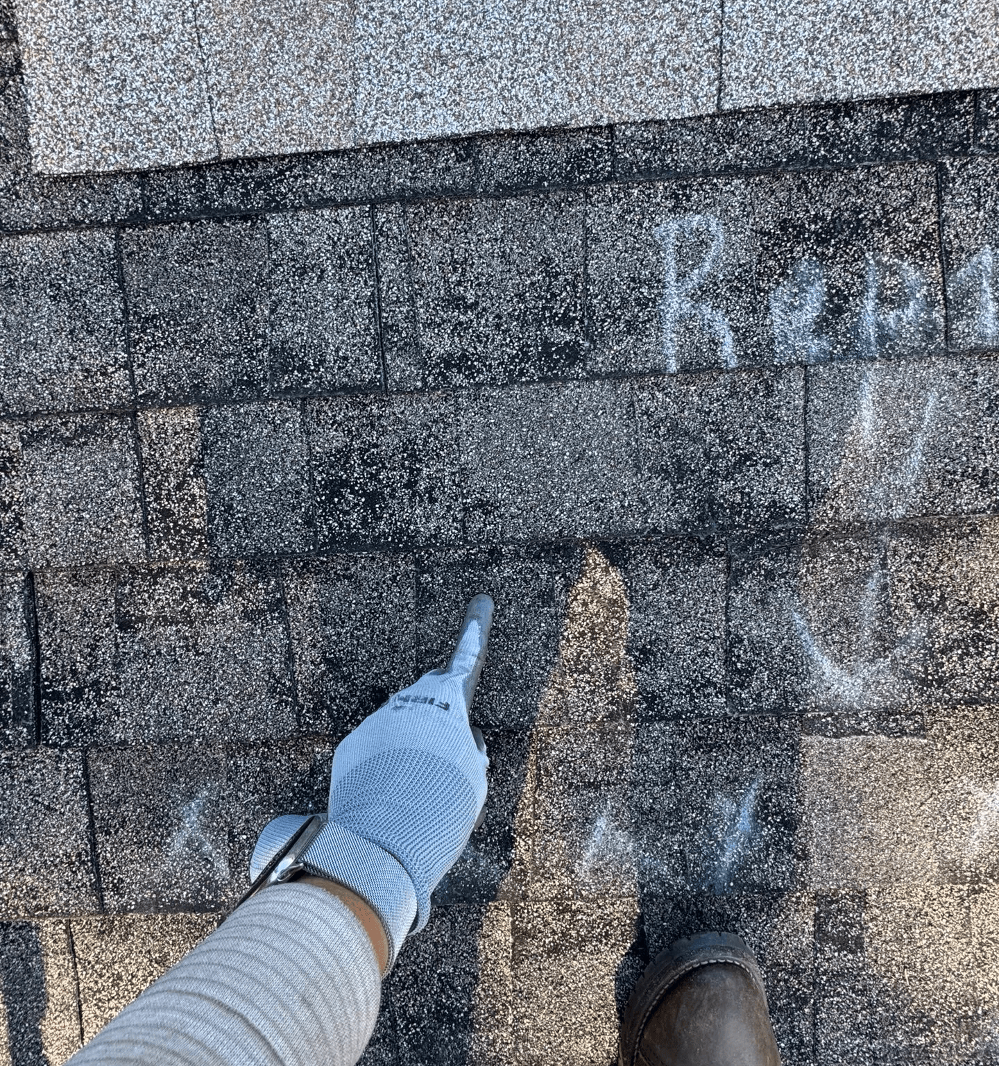 A man standing on top of a skateboard ramp