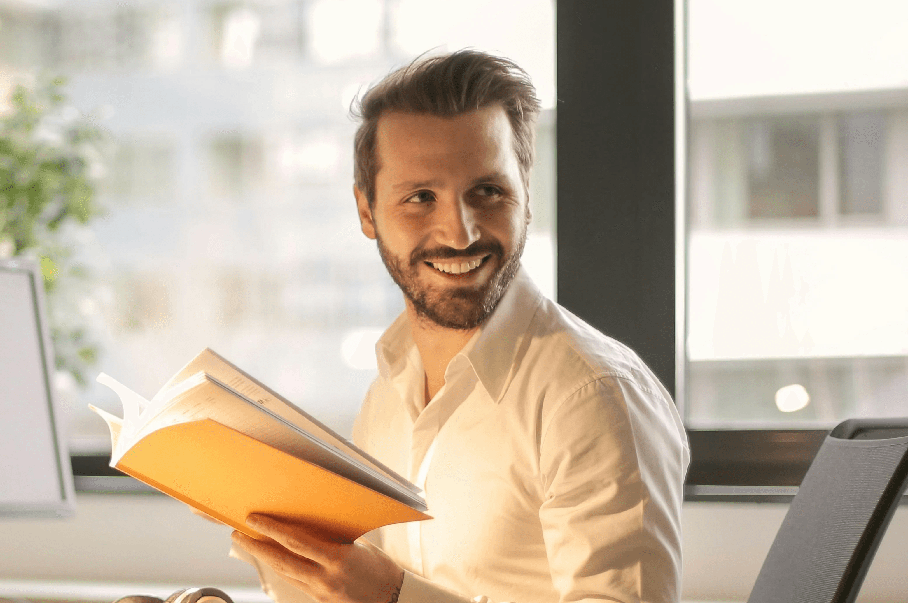 Rows of parmesan cheese wheels are neatly stacked.