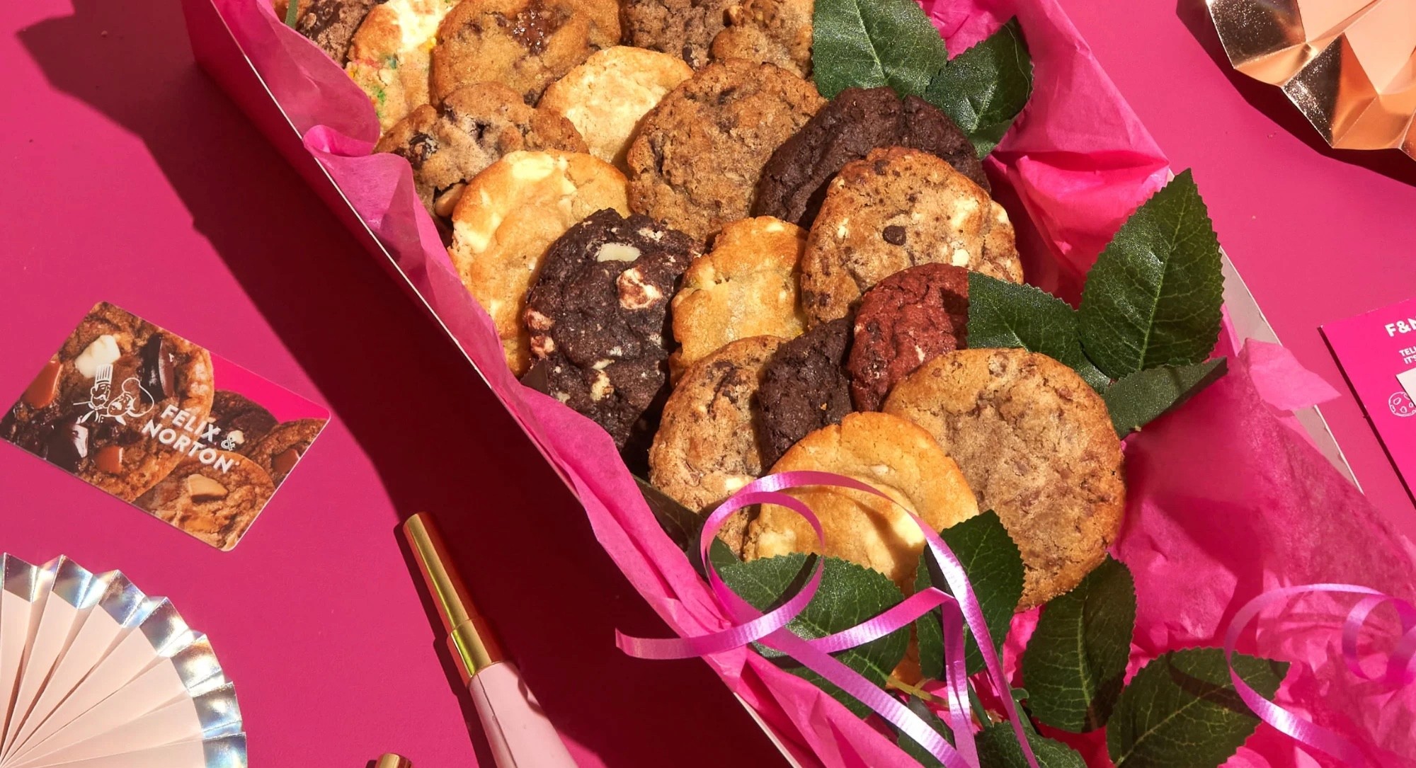 Félix & Norton cookie gift box with pink tissue, ribbon and a gift card