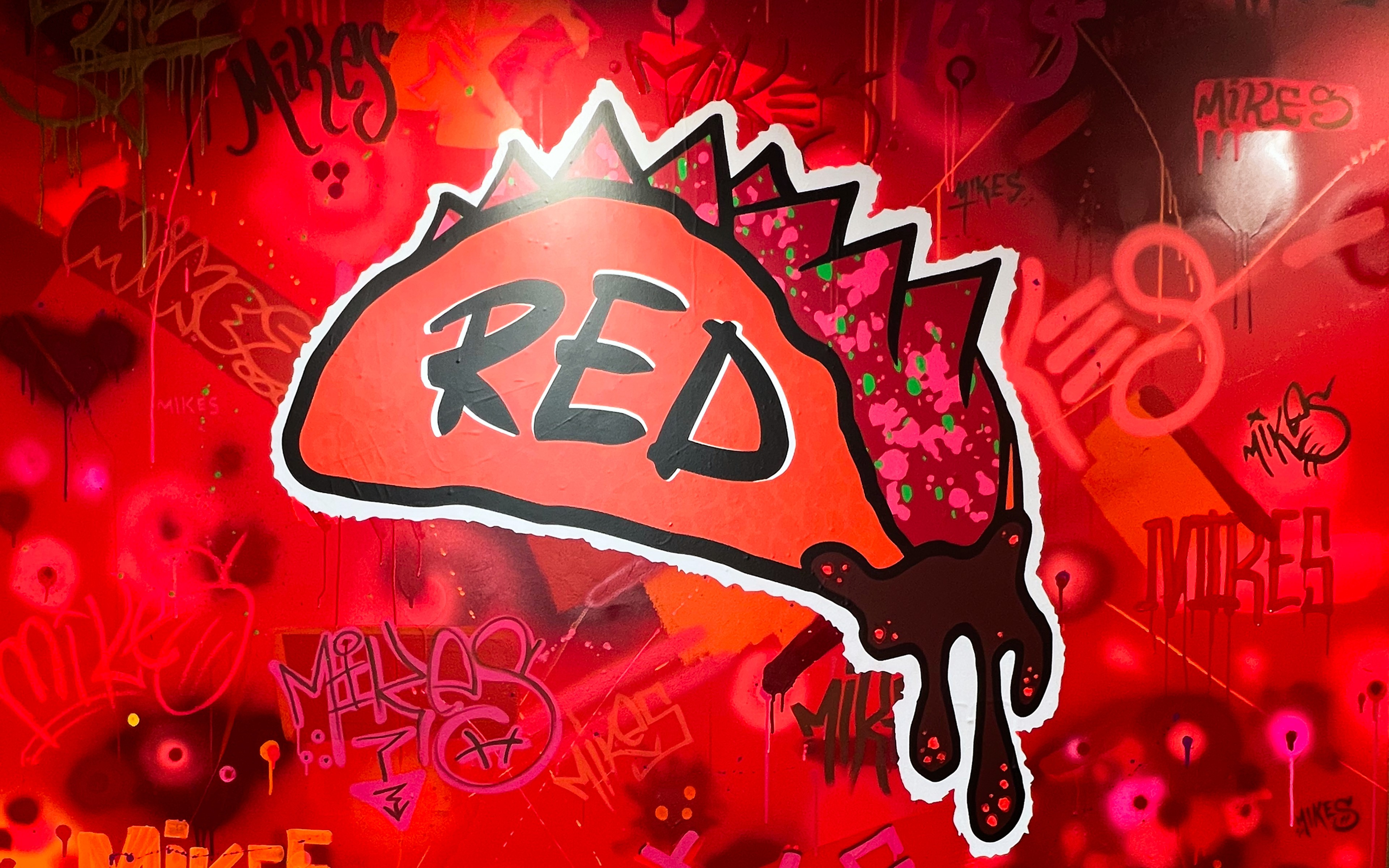 Mike’s Red Tacos “RED” taco logo graphic used in the interior brand world — San Diego, CA (2023)