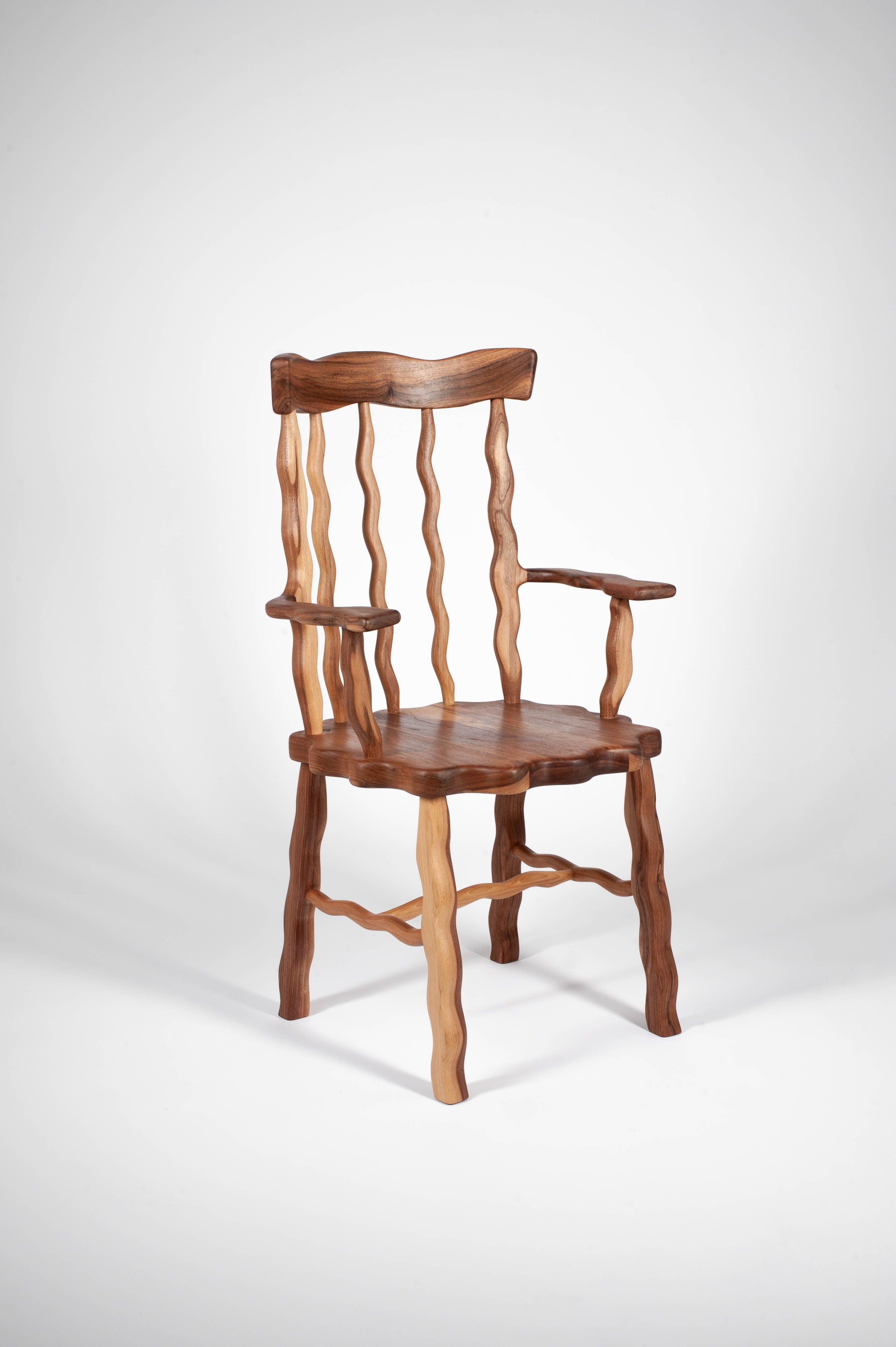 Walnut Windsor Armchair at an angle on a white background