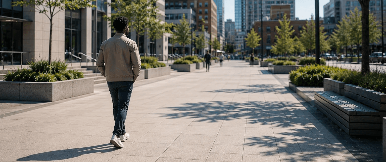 Individual walking through a modern downtown setting representing successful criminal law matters and client outcomes in Ontario.