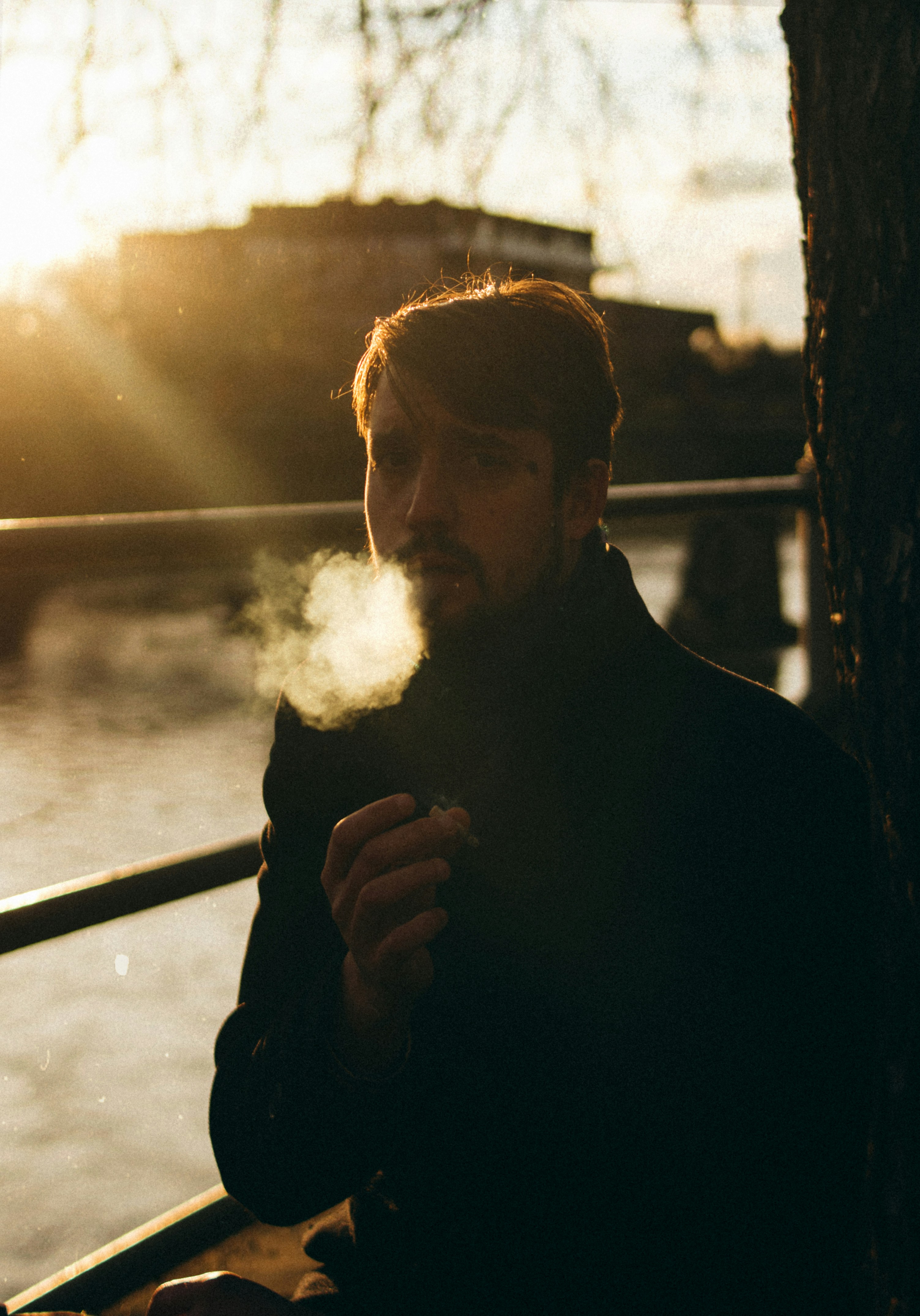 man in black long sleeve shirt smoking