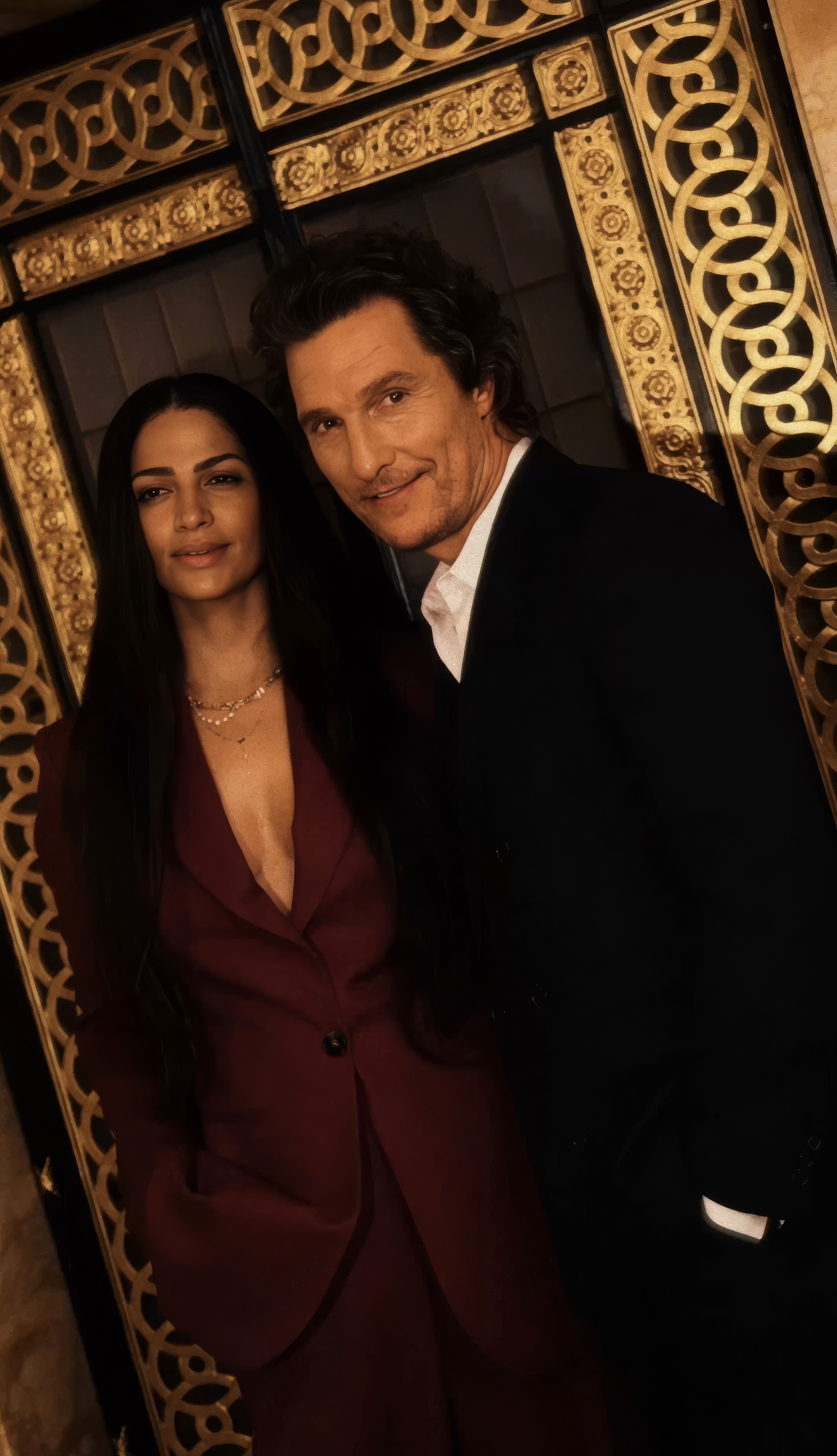 Bride and groom walking on street at night