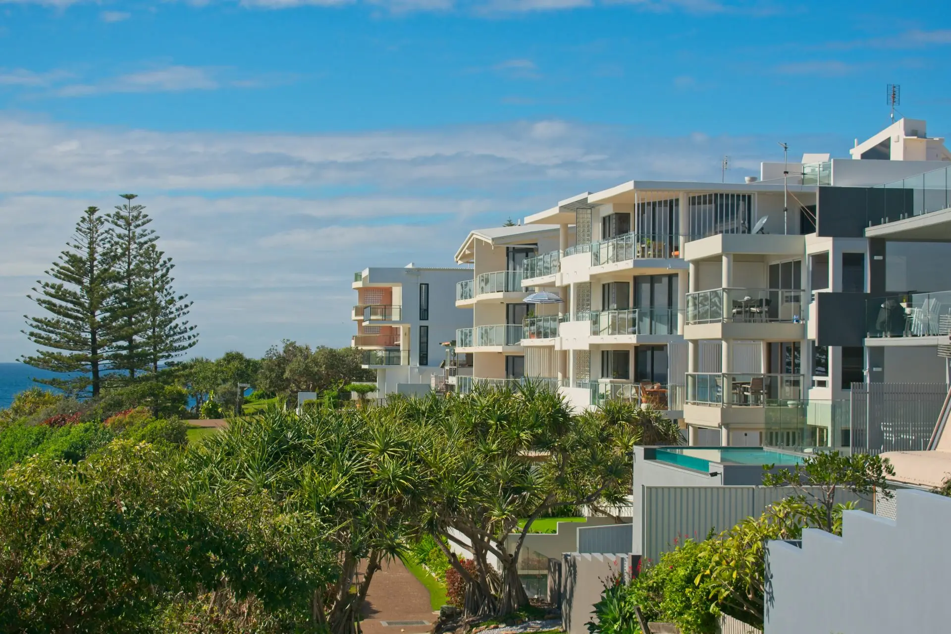 Modern apartments with balconies and ocean view