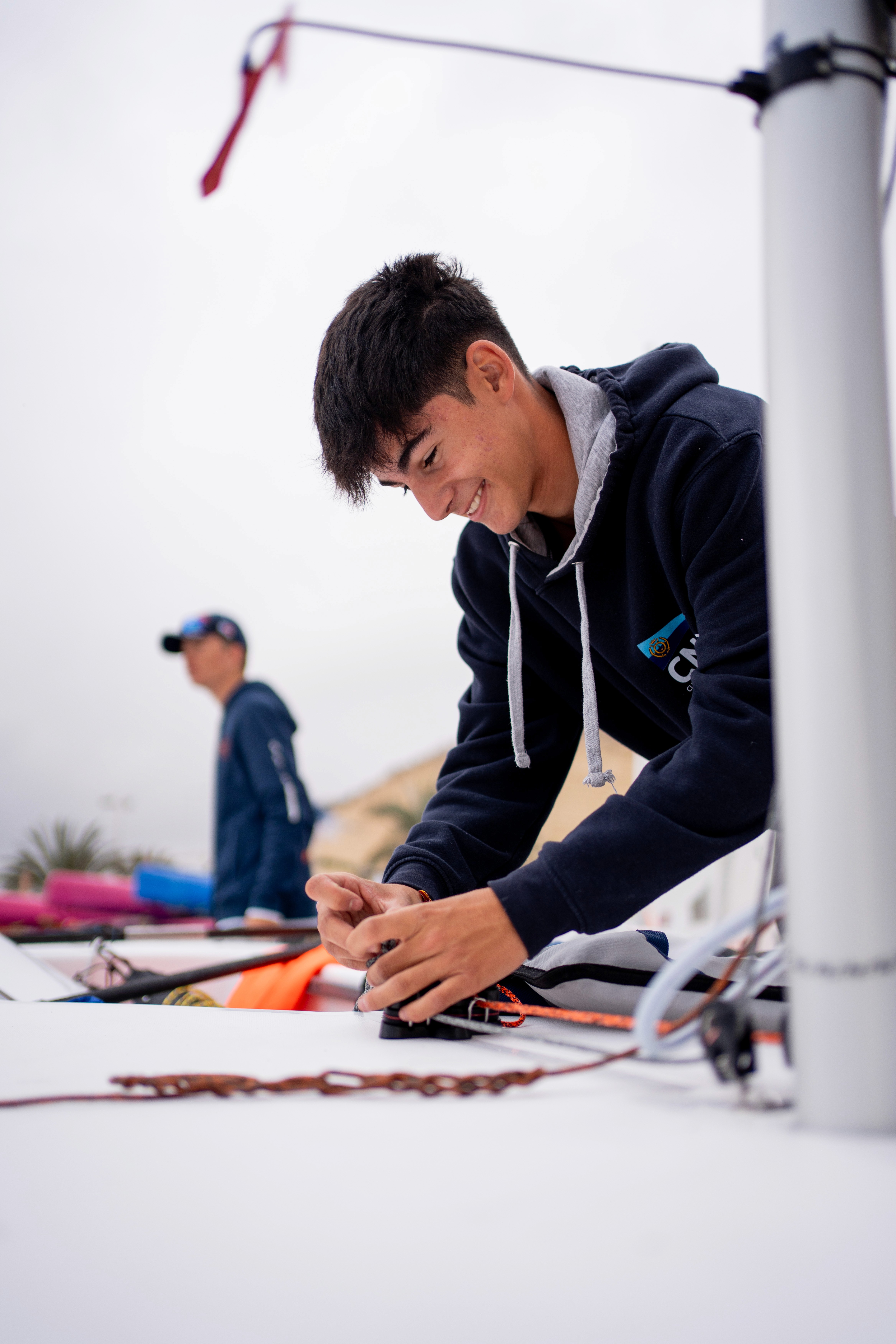  A woman in a helmet with a light trail, suggesting movement or speed in a dynamic outdoor setting.