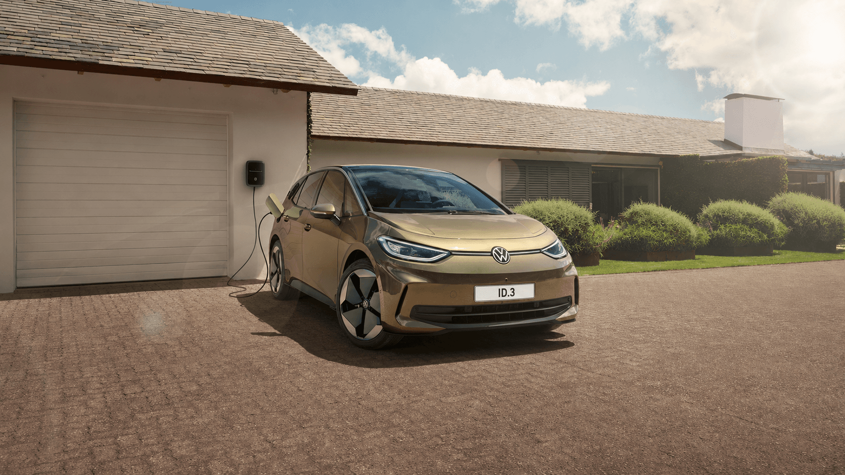 Volkswagen ID.3 charging outside a modern home.