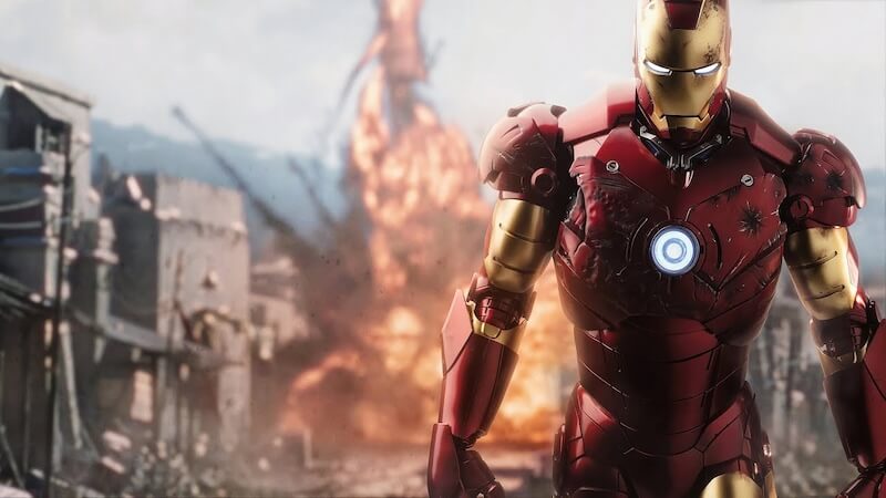 Iron Man walks away from an explosion.