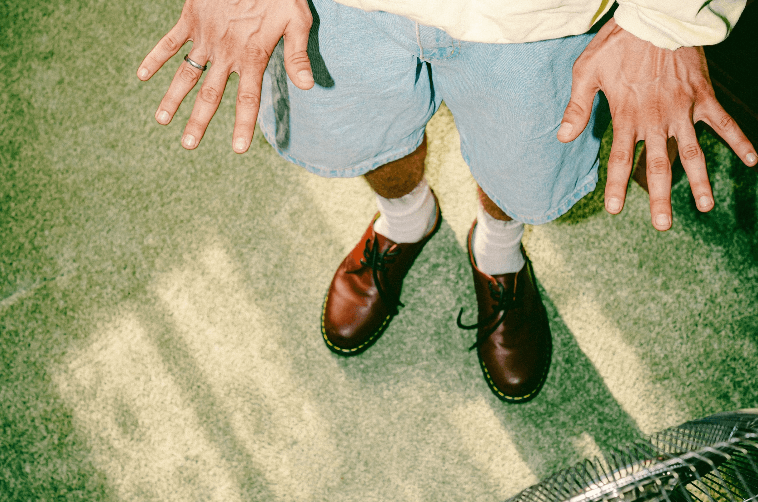 Close-up of person in casual shorts and boots, representing B2B sales teams exploring flexible Cognism alternatives in 2026