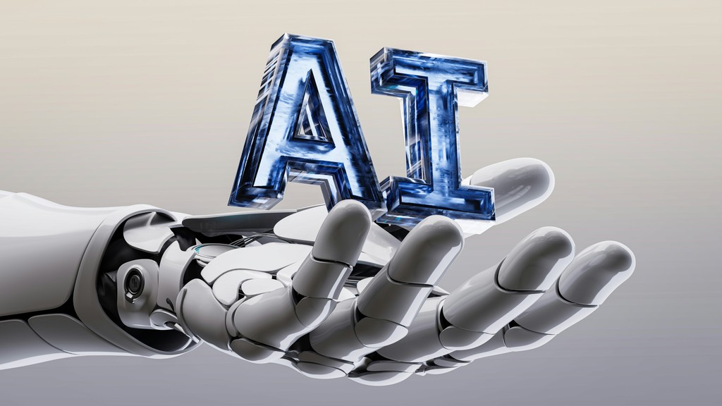 A robotic hand holding the metallic letters "AI," symbolizing artificial intelligence, innovation, and advanced technology in a sleek, futuristic design.