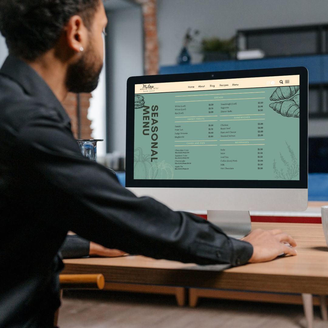 Bakery menu being looked at by man