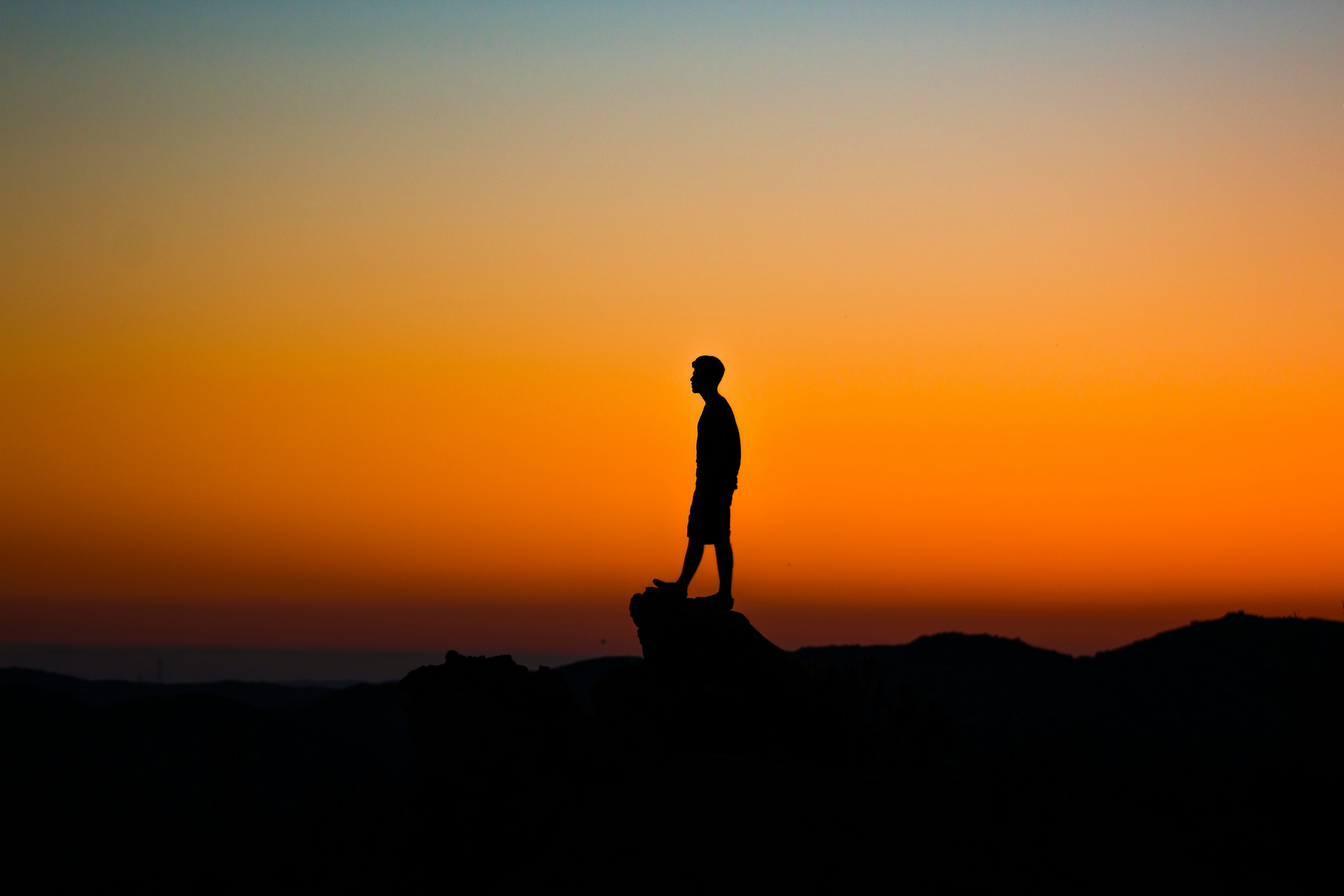 silhouette of man during sunset