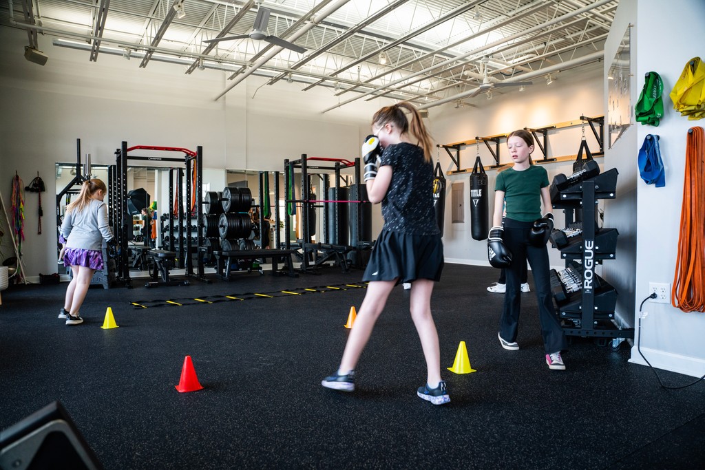 Gym Instructor with boxing gloves in Anchor Fitness Pewaukee