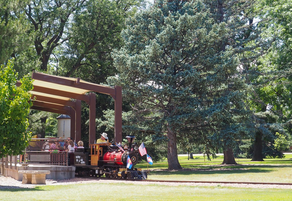 Small train with children riding in North Loveland.