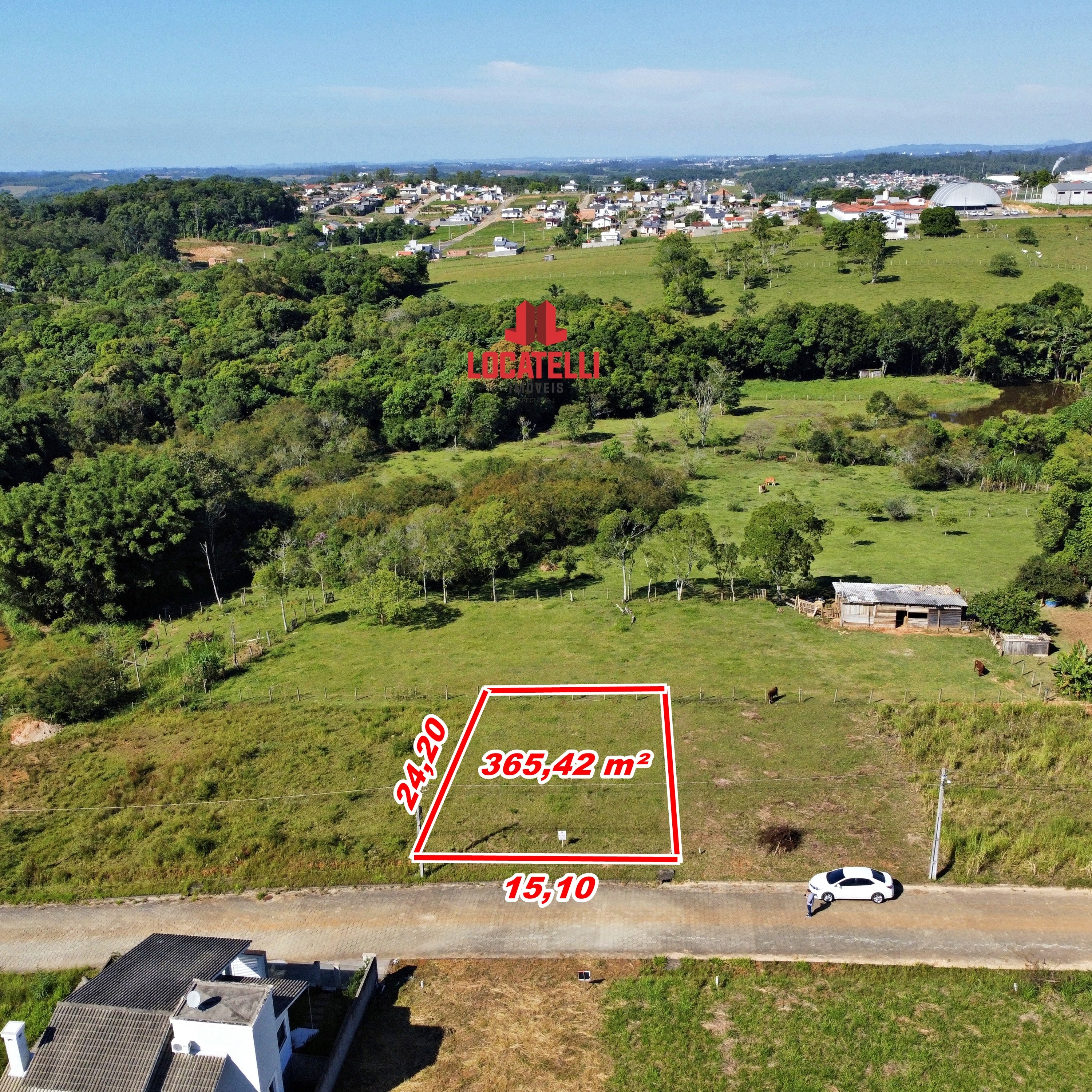 A modern brick house with a two-car garage, well-manicured lawn, and clear blue sky in the background.