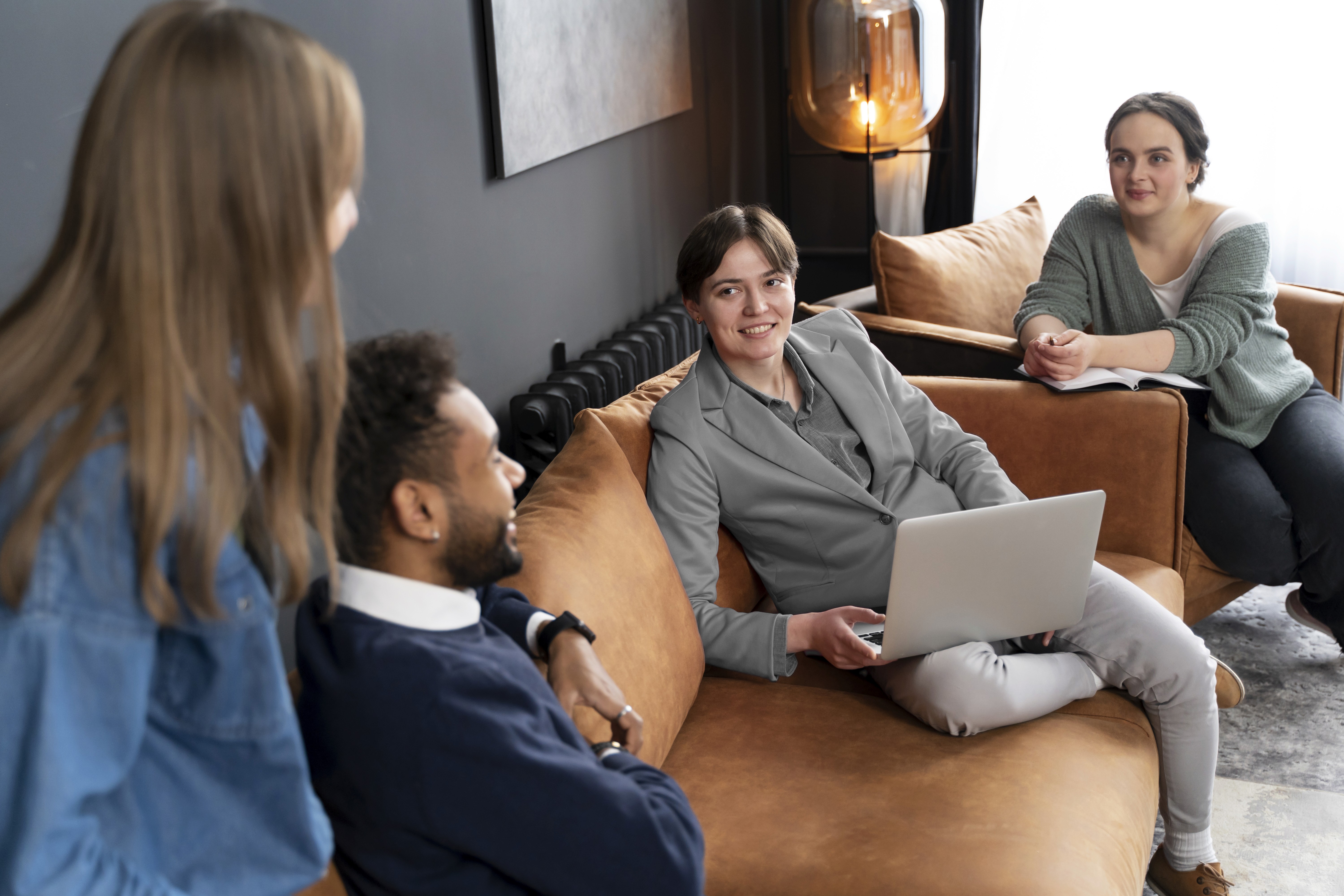 Aerial view of a winding road cutting through rocky terrain with patches of grass.