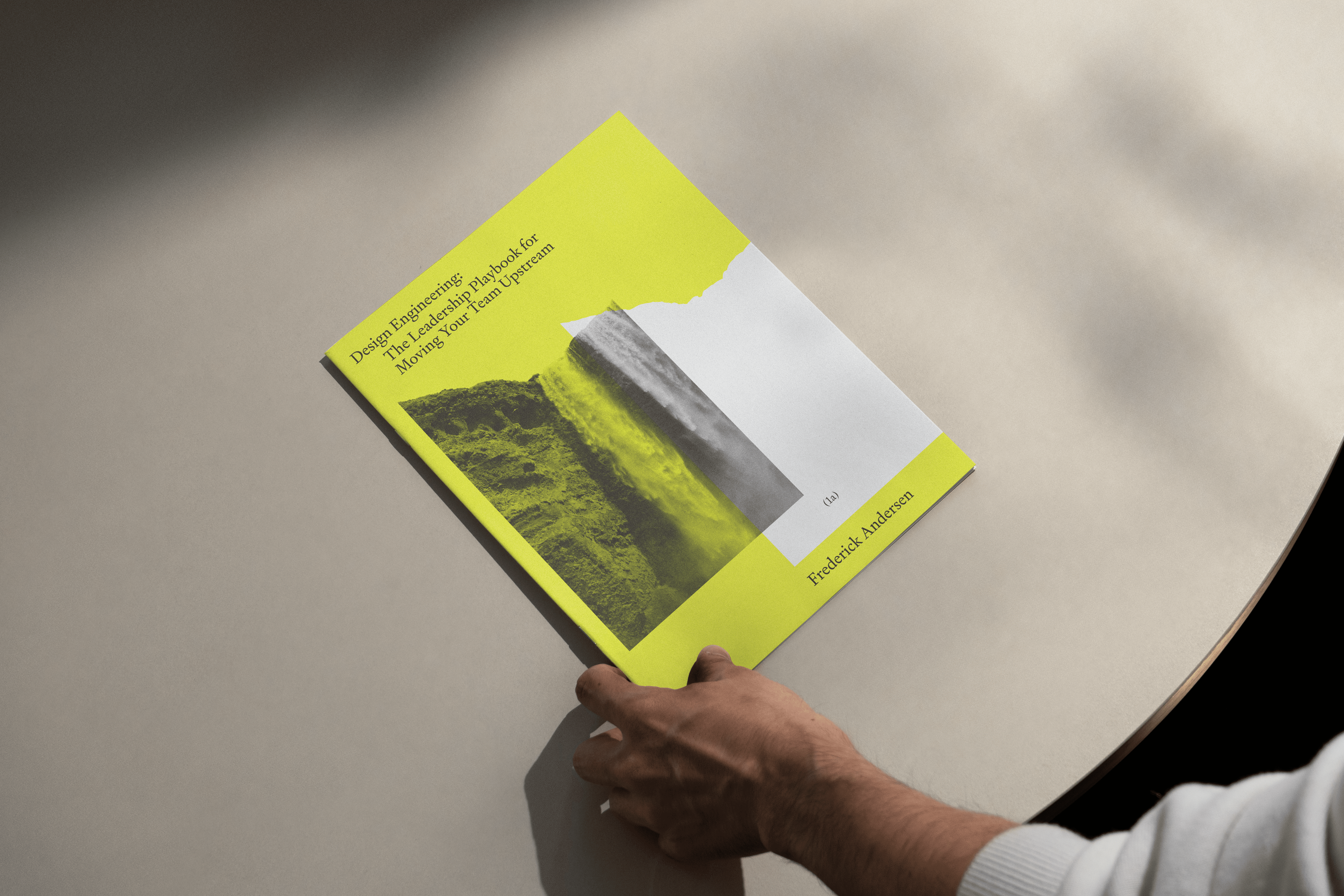 The cover of the book on a table.