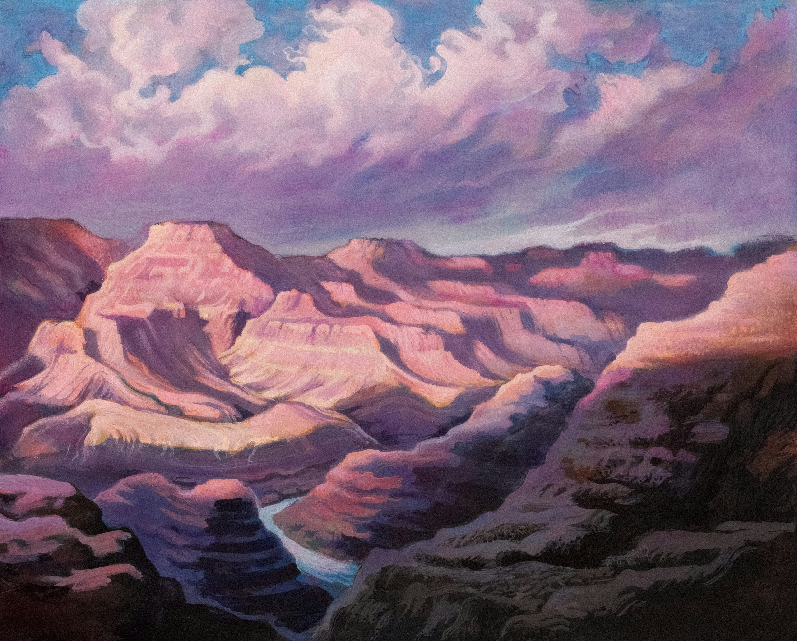 Majestic canyon view under a cloudy, colorful sky.