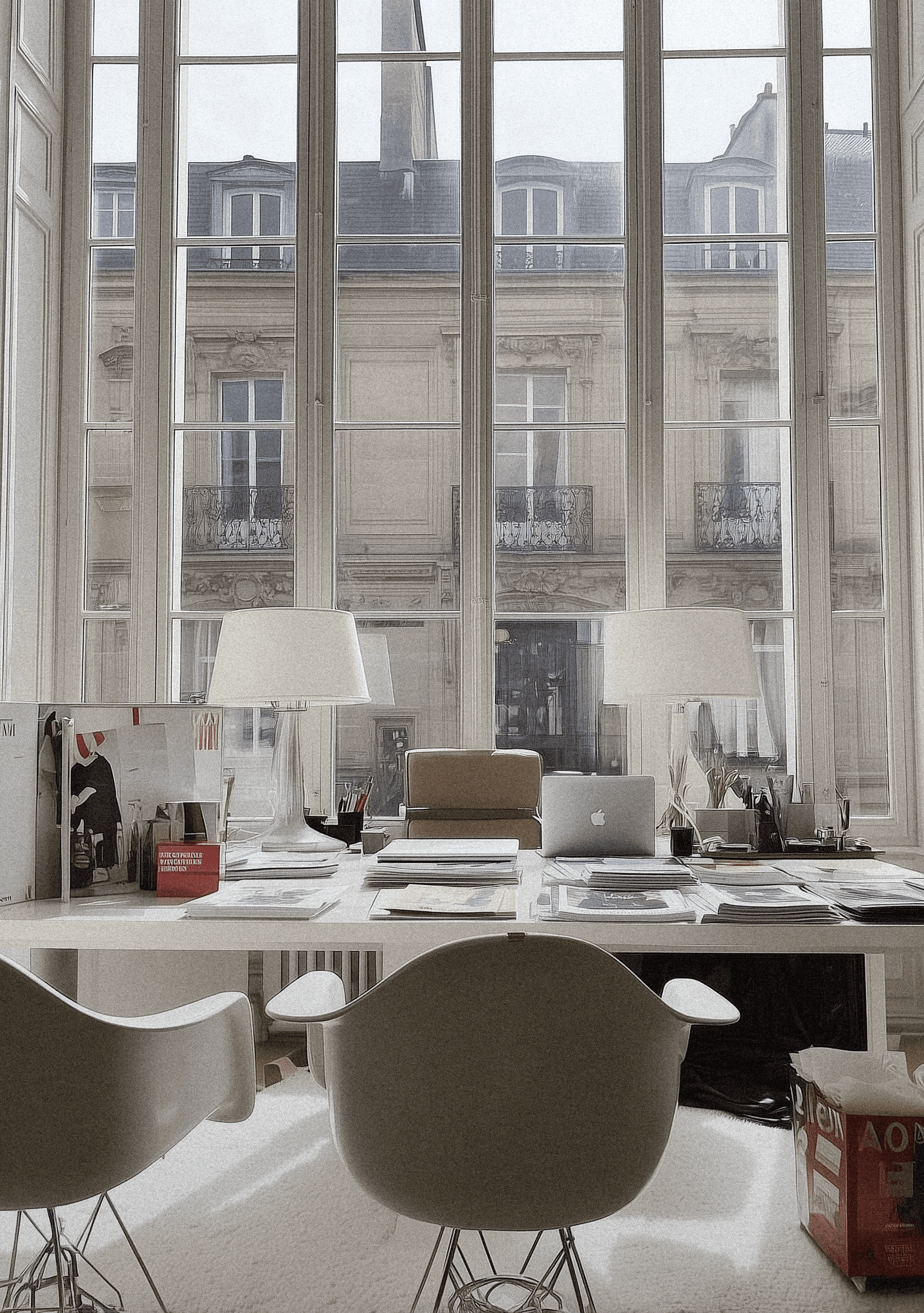 Minimal architectural corner by the sea with shallow water and sunlight reflections.