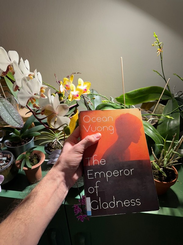 Pavel Rat holding a recently finished book