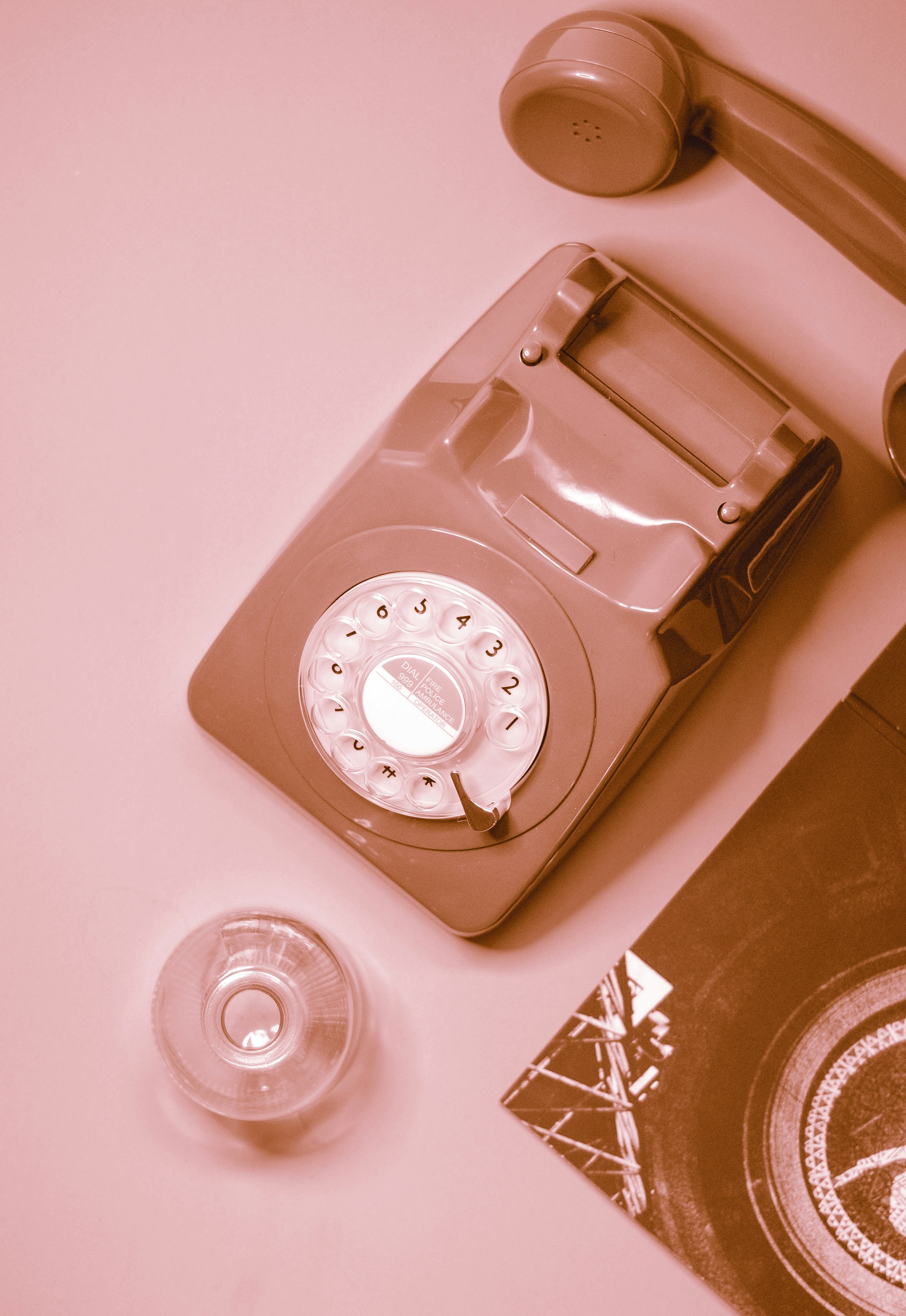 Pink rotary telephone with a dial