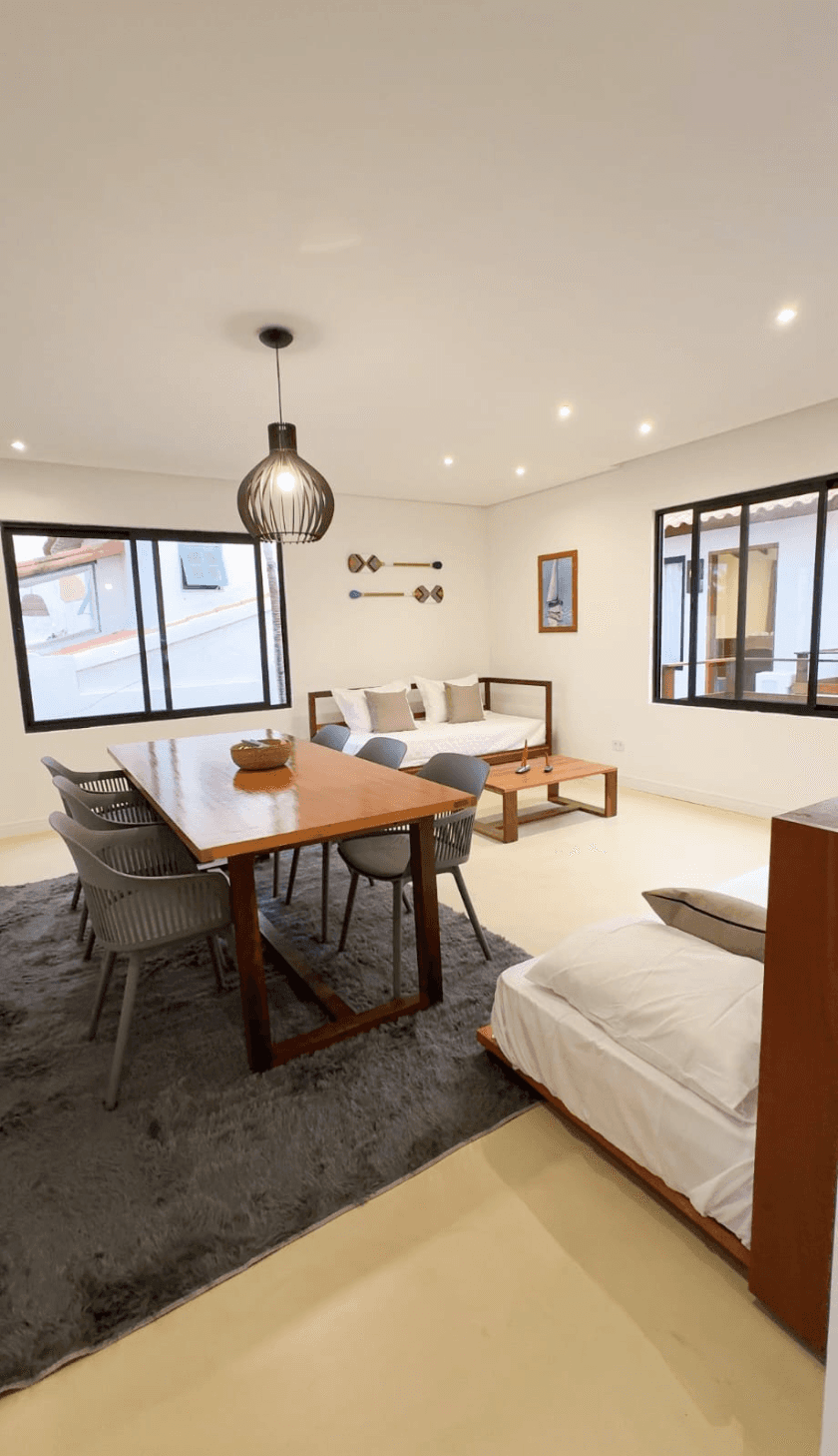 A luxurious penthouse suite in a coastal boutique hotel.