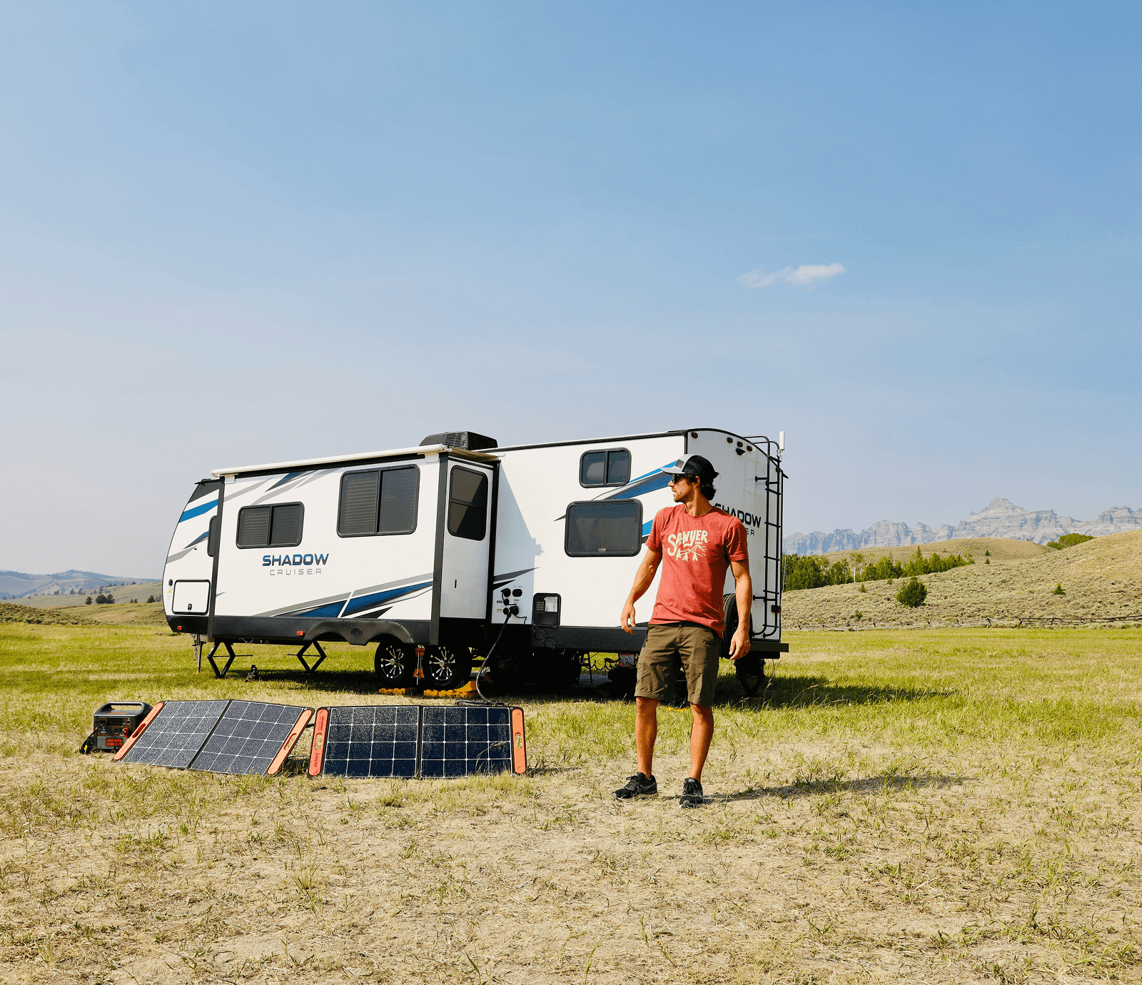 A cozy log cabin with solar panels and a portable generator neatly