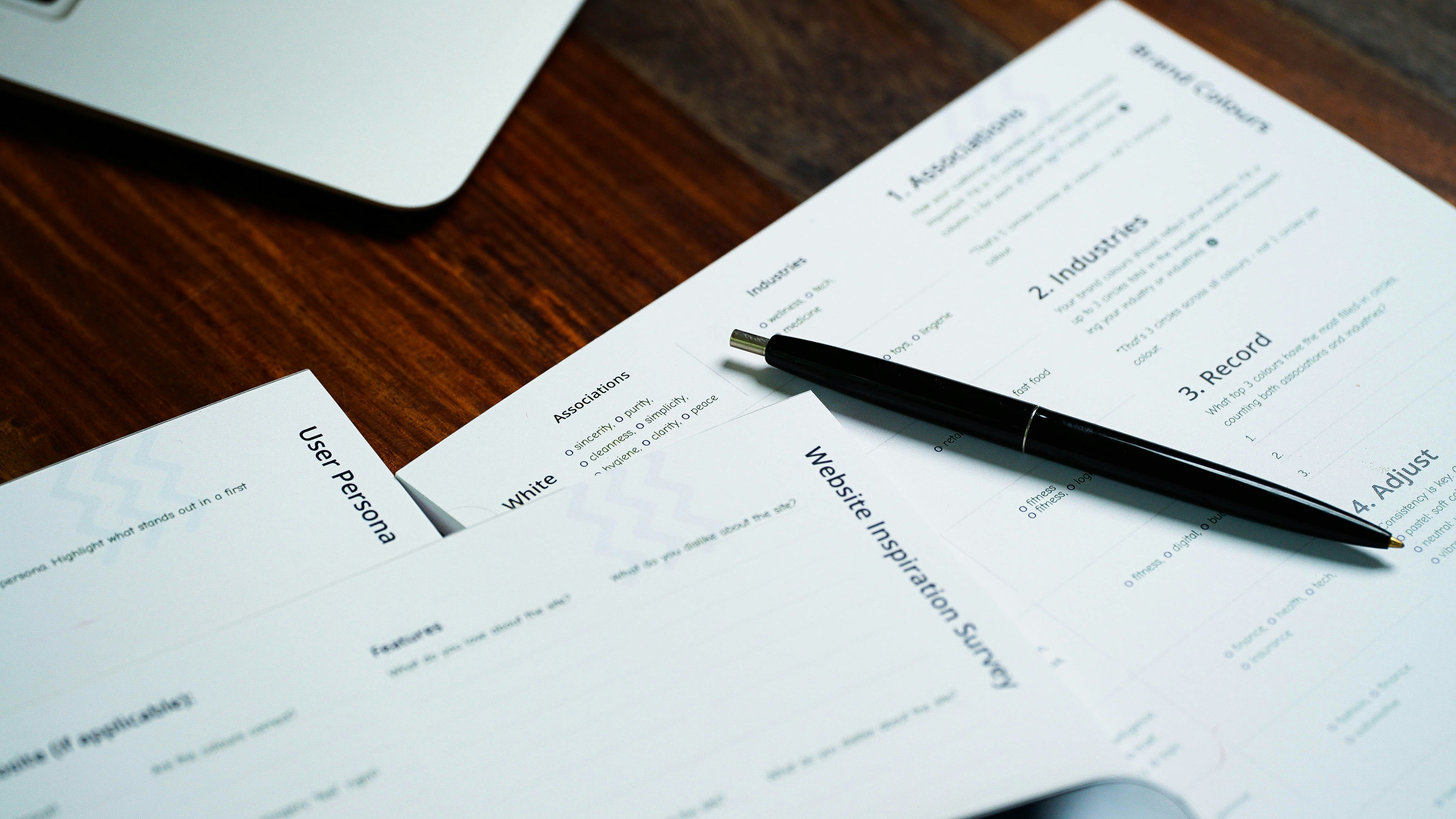Injury report template pages with a pen on a desk