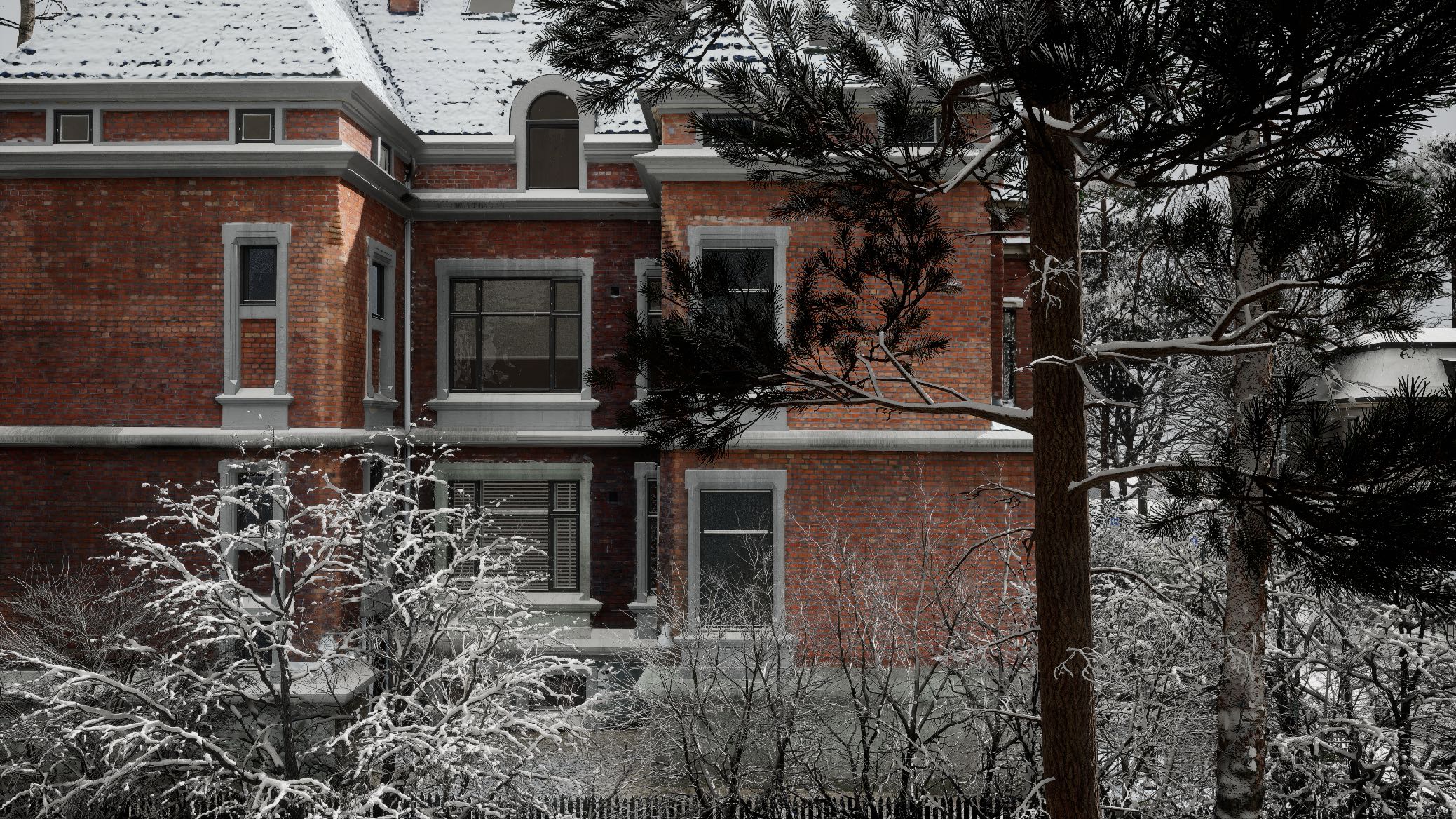 Side view of snow-covered bushes and a snow-covered brick house.