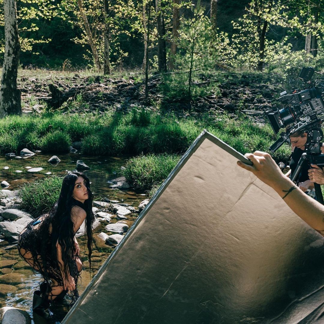 An orange cube-shaped side table is shown.
