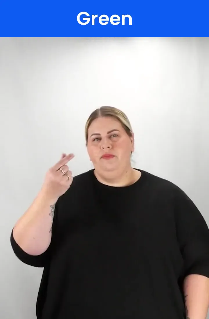 A Deaf signer signs GREEN in ASL