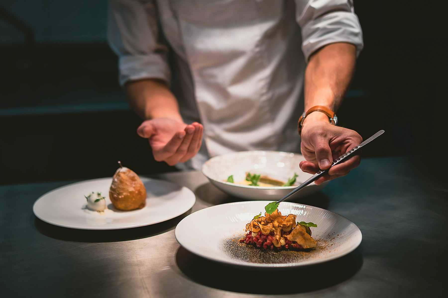 Chef decorating the plate