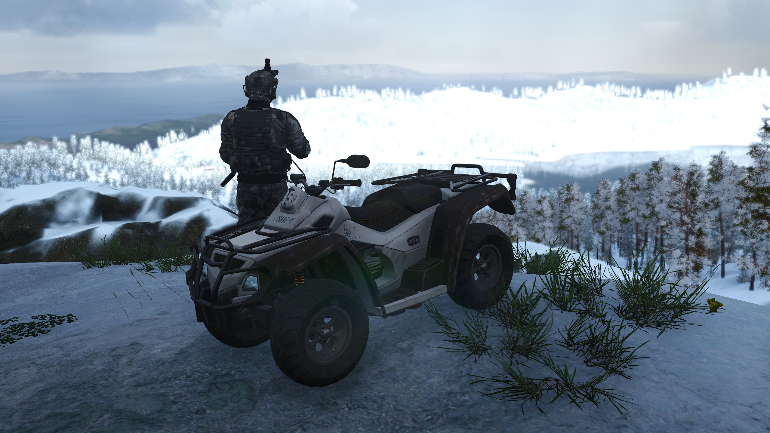 An image featuring a quad bike overlooking a snowy valley