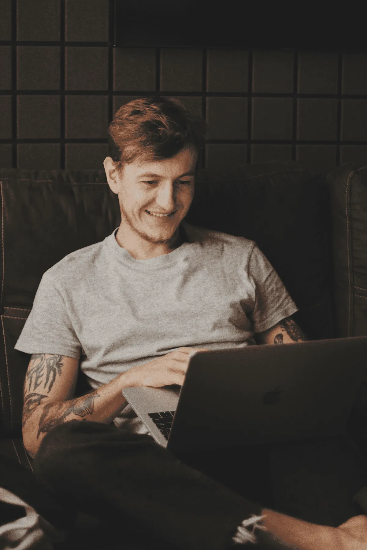Man smiling working on computer