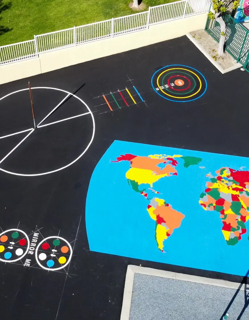 Aerial photo of freshly paved asphalt playground area with crisp, bright painted games