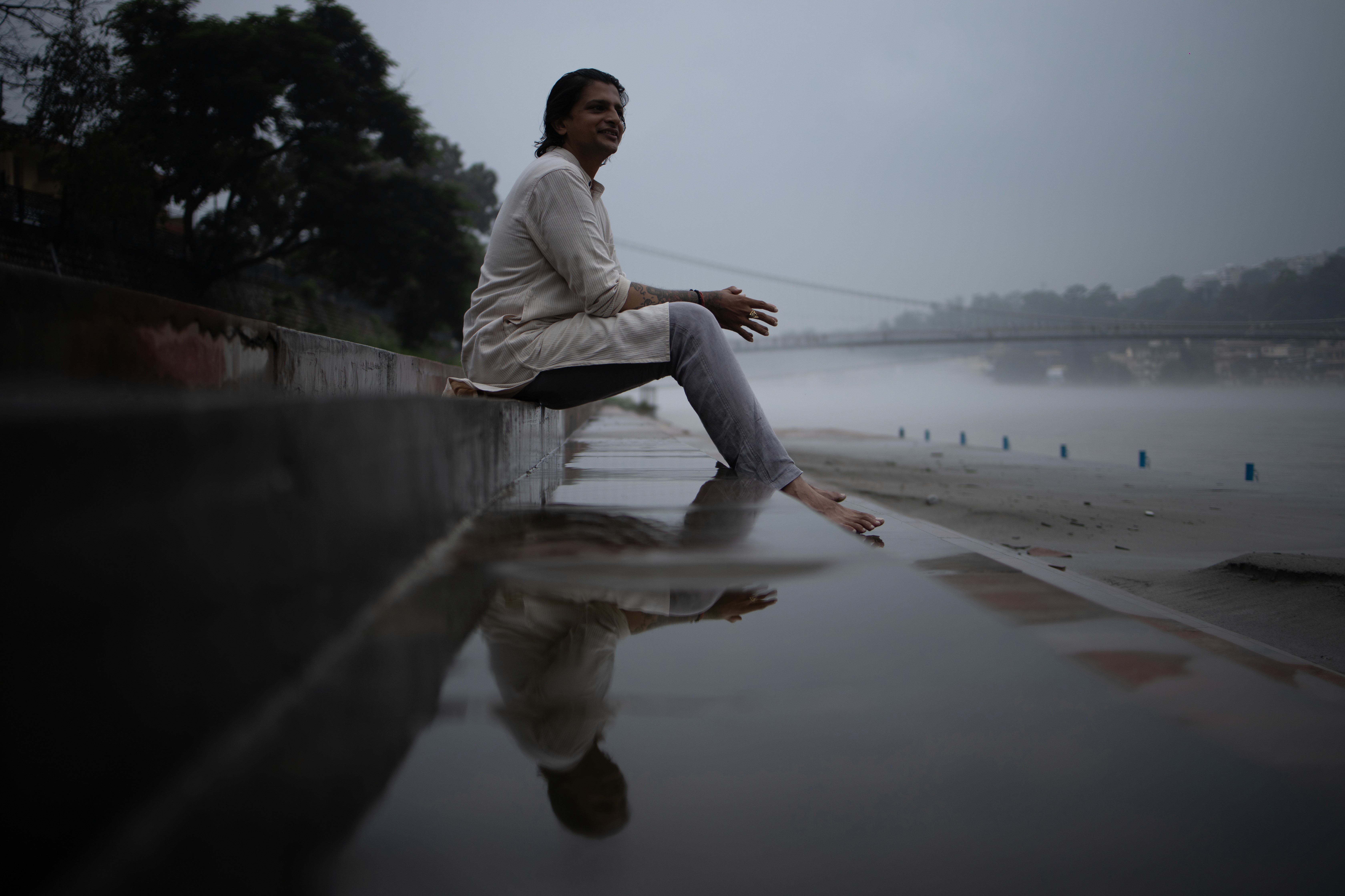 woman in gray dress holding a stainless steel bowl