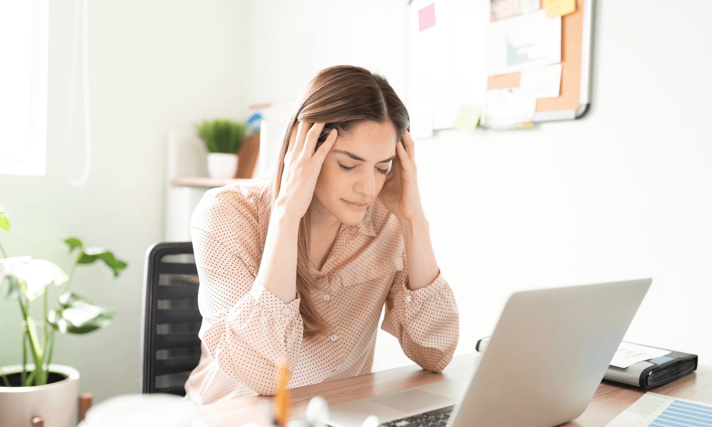 woman stressed while working on laptop