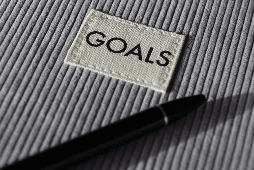 Notebook labelled goals representing flexible, goal-focused therapy and personal growth