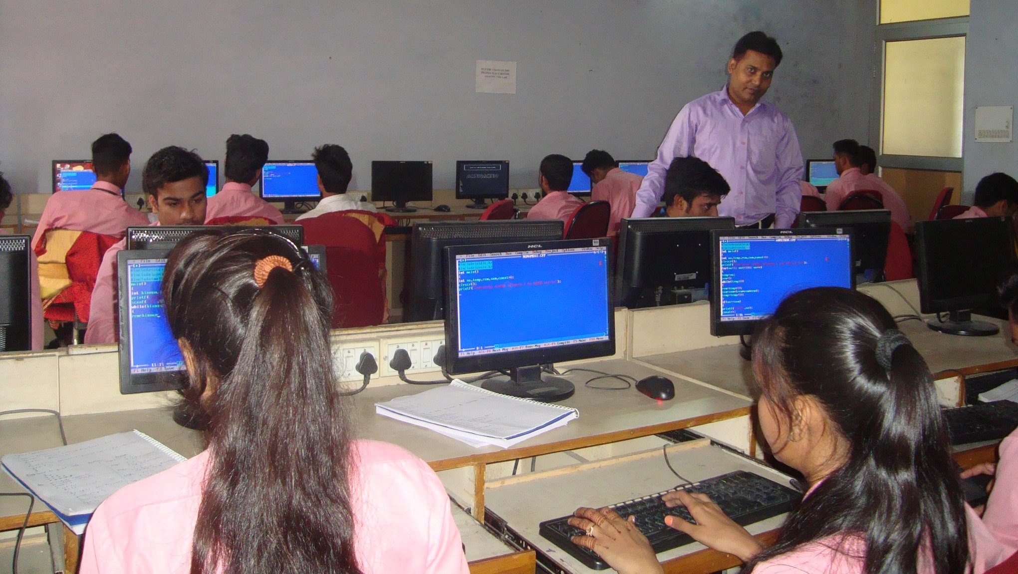 Full moon rising behind a house at night