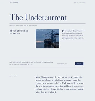 Newsletter landing page website built with AI showing a periodical style nameplate, a container ship at dusk, a hairline subscribe row and a long serif statement on cool grey