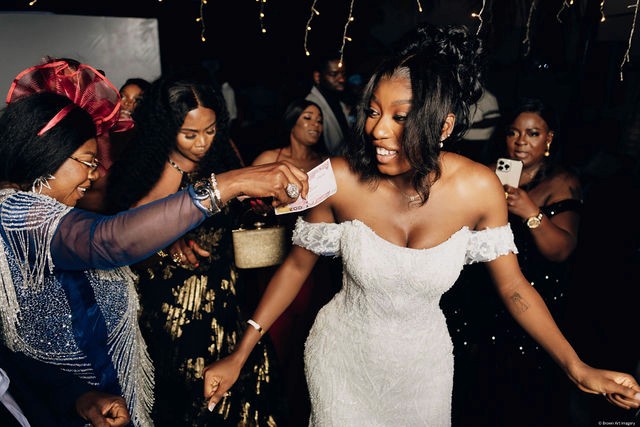 Newlyweds celebrating their wedding ceremony with family and friends.